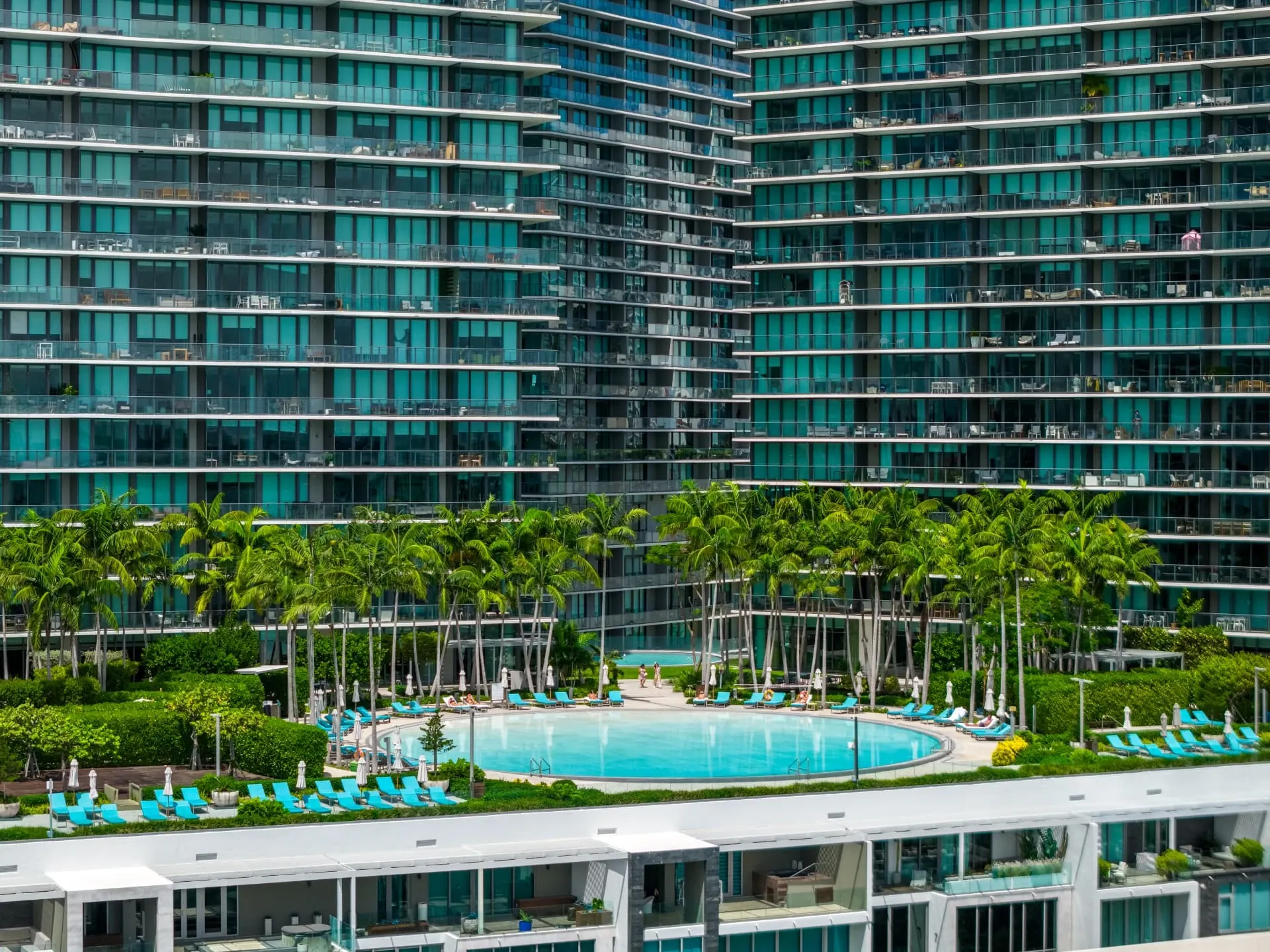 Miami condo towers and a resort pool from above